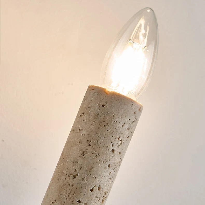 Close view of the natural travertine texture and lamp holder