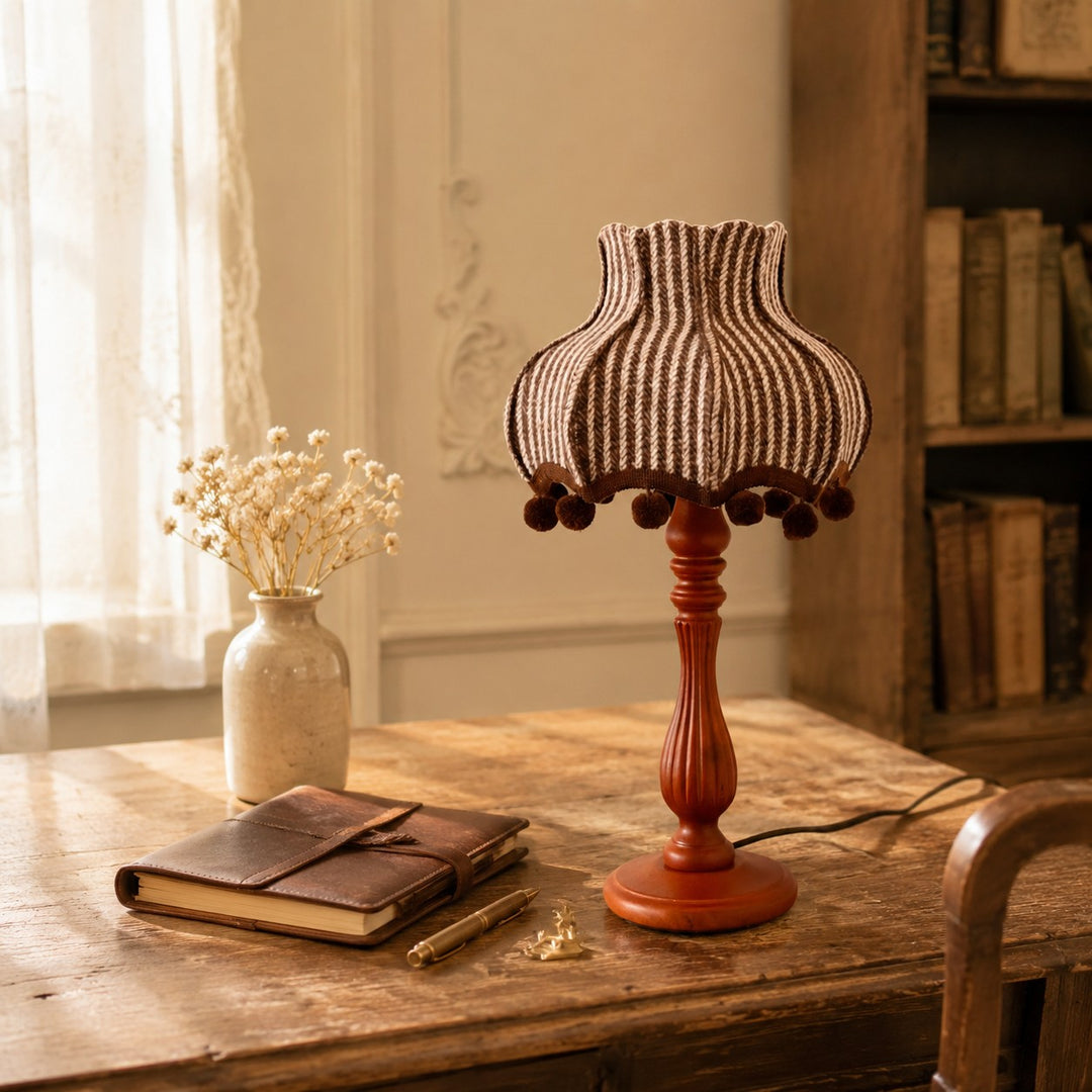 Vintage striped wood table lamp styled on a side table