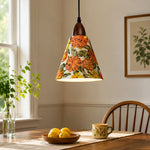 Bild in Gallery-Viewer laden, Orange floral pendant above sunlit wooden dining table