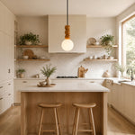 Cargar imagen en el visor de la Galería, Wood bead globe pendant illuminating a warm neutral kitchen island