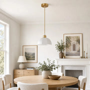 Milk glass pendant light in a refined interior