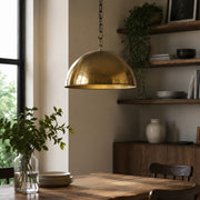 Antique brass dome pendant in a dining room