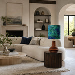 Bild in Gallery-Viewer laden, Teal botanical ceramic table lamp in a living room