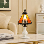 Load image into Gallery viewer, Orange stained glass table lamp styled on a bedside table in a cream bedroom