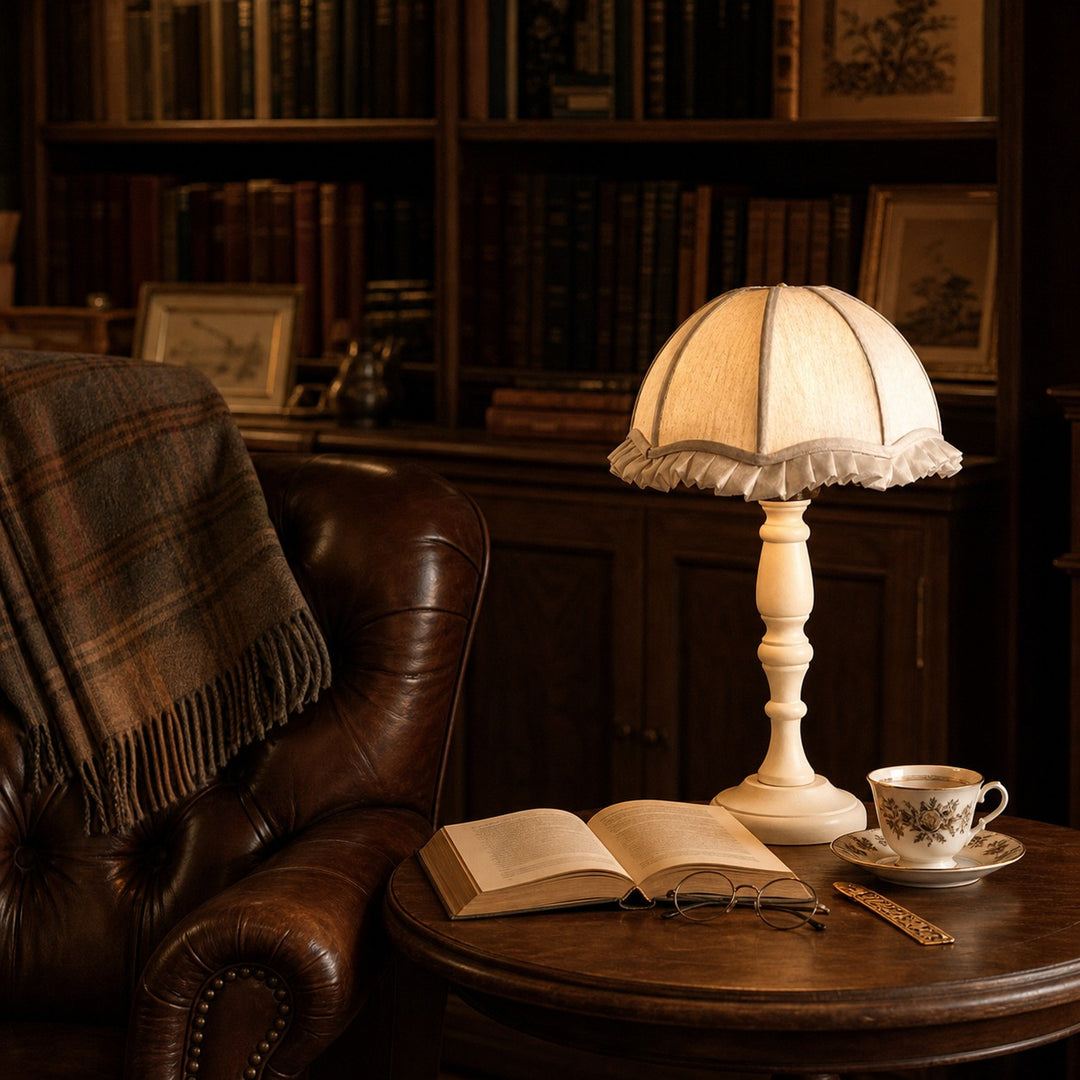 Vintage fabric table lamp styled beside a reading chair