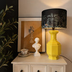 Load image into Gallery viewer, Faceted Lemon Yellow ceramic table lamp on a console