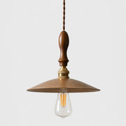 Hammered brass pendant with walnut wood on white background