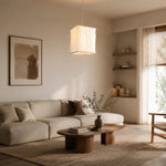 Load image into Gallery viewer, Sculptural linen pendant light above a neutral sitting area