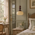 Charger l'image dans la visionneuse de galerie, Cream glass pendant beside a bedroom bed