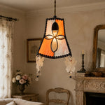 Cargar imagen en el visor de la Galería, Warm window scene with vibrant orange shell pendant