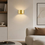 Load image into Gallery viewer, Gold brass wall sconce installed in an interior