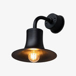 Charger l'image dans la visionneuse de galerie, Matte black brass wall sconce with warm bulb glow