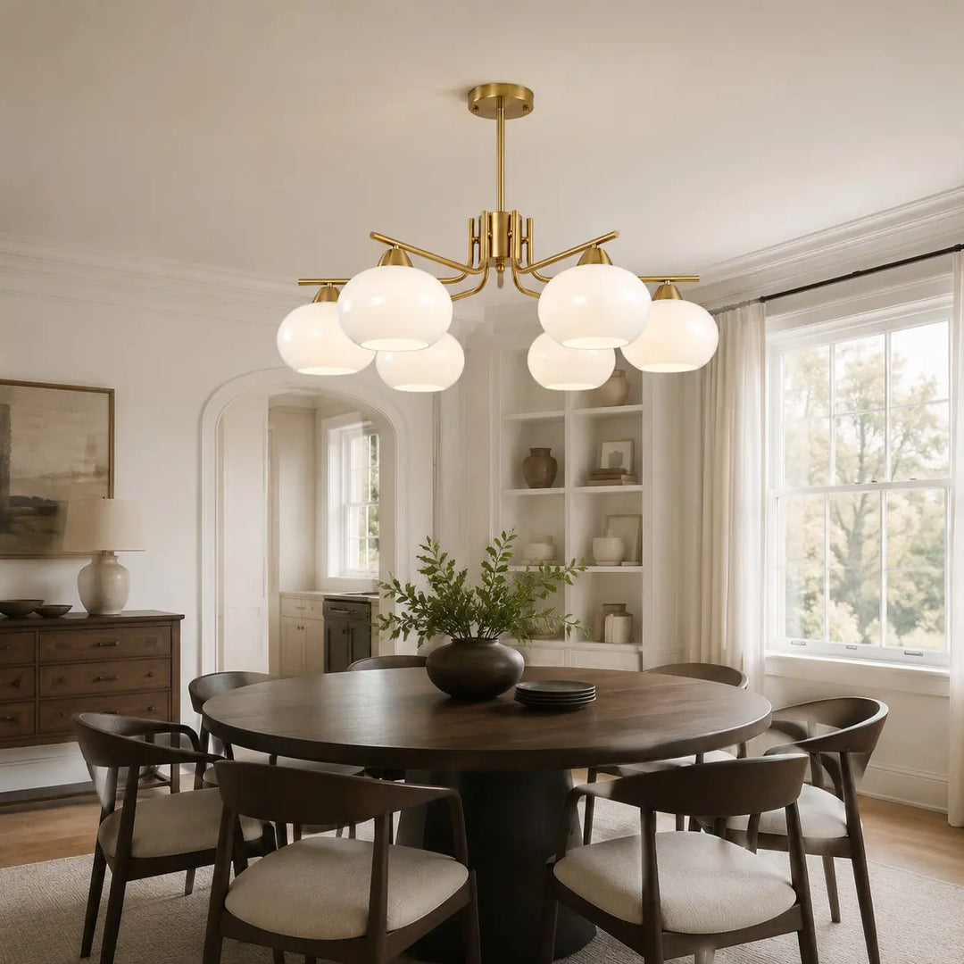 Gold milk glass chandelier in a warm dining room