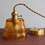 Load image into Gallery viewer, Amber hammered glass pendant light with brass-tone canopy