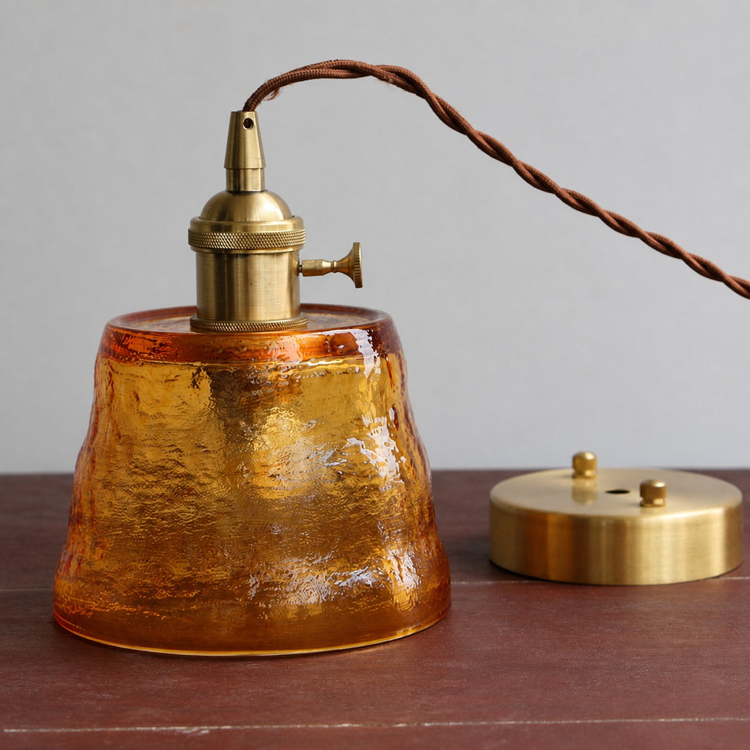 Amber hammered glass pendant light with brass-tone canopy