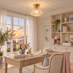Charger l'image dans la visionneuse de galerie, Large amber glass ceiling light glowing above a table