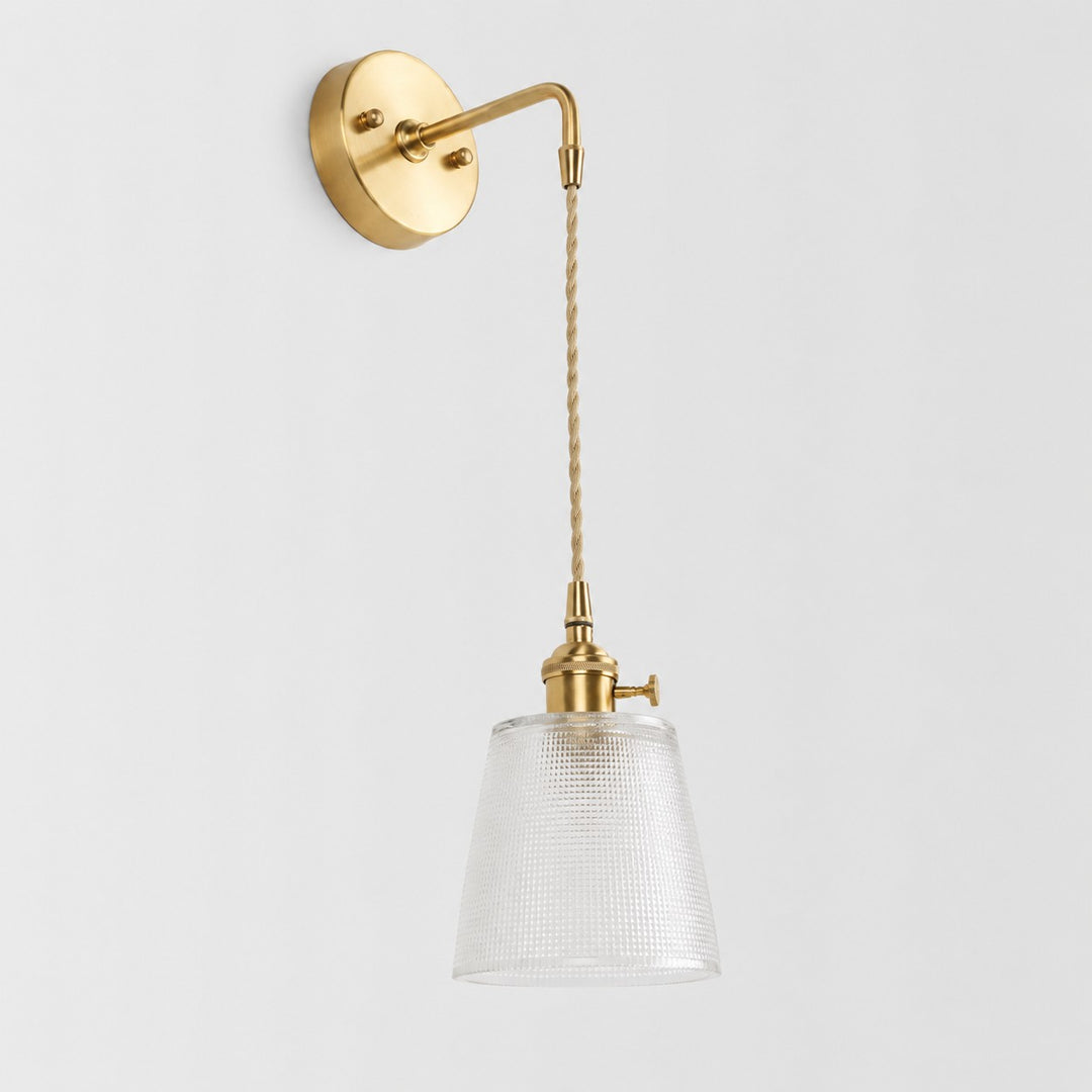 Semi clear glass wall light with brass arm, BW shade 12 cm high and 13 cm diameter