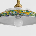 Bild in Gallery-Viewer laden, Close detail of yellow floral ceramic shade pattern and visible bulb opening
