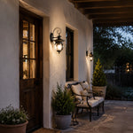 Load image into Gallery viewer, Pair of black wall lanterns beside an exterior doorway