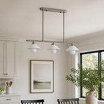Load image into Gallery viewer, Three-head pendant above a calm dining space