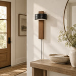Load image into Gallery viewer, Walnut and black travertine wall sconce above a nightstand