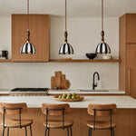 Charger l'image dans la visionneuse de galerie, Three striped fabric pendant lamps above a warm wood kitchen island