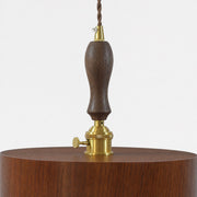 Turned dark wood suspension grip and brass-tone pendant hardware