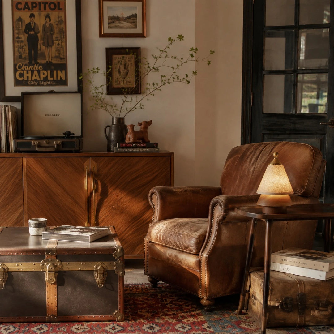 Small ambient table lamp beside a leather lounge chair