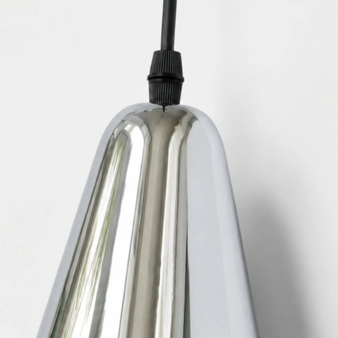 Polished chrome shade edge and cord entry detail
