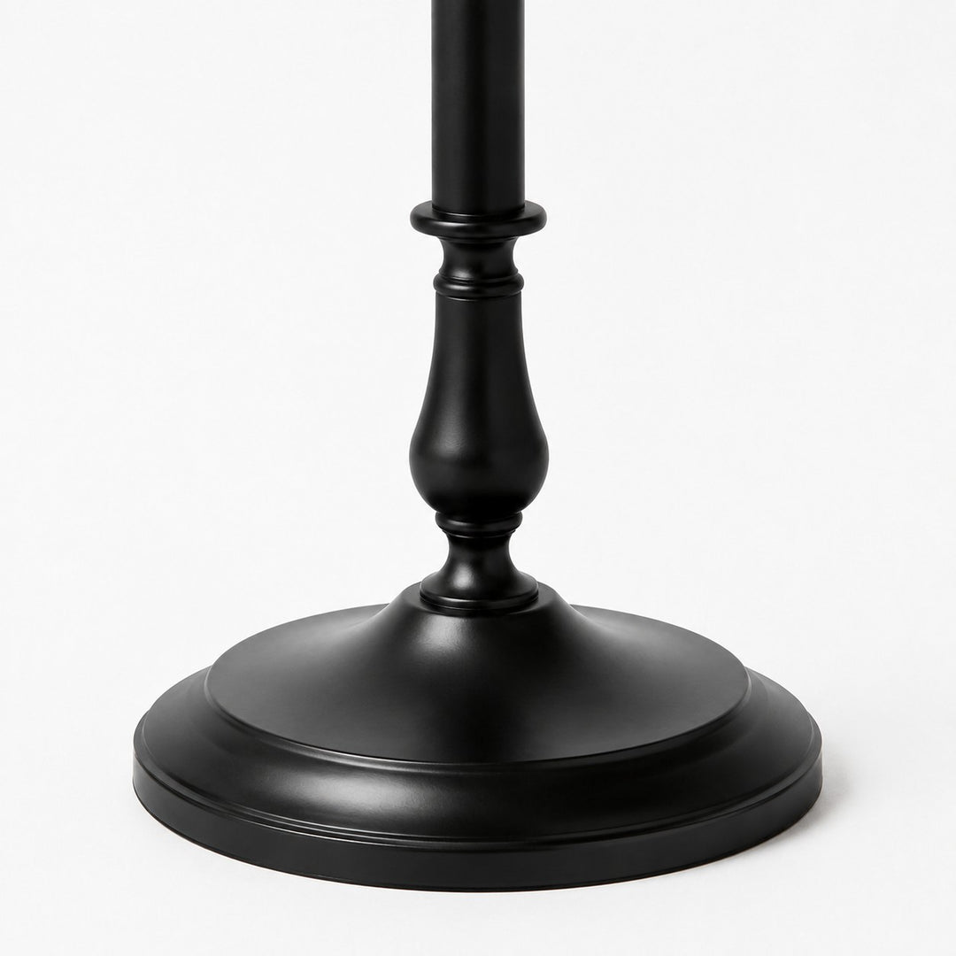 Close-up of stable round black iron floor lamp base