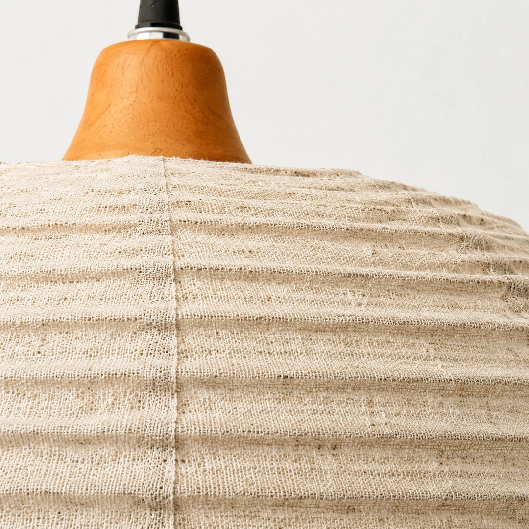 Close view of the fabric shade and wooden top detail