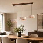 Load image into Gallery viewer, Three-light yellow travertine linear LED pendant over a dining table