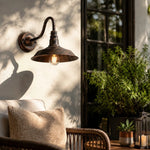 Charger l'image dans la visionneuse de galerie, Rustic wall light casting warm shadows outdoors
