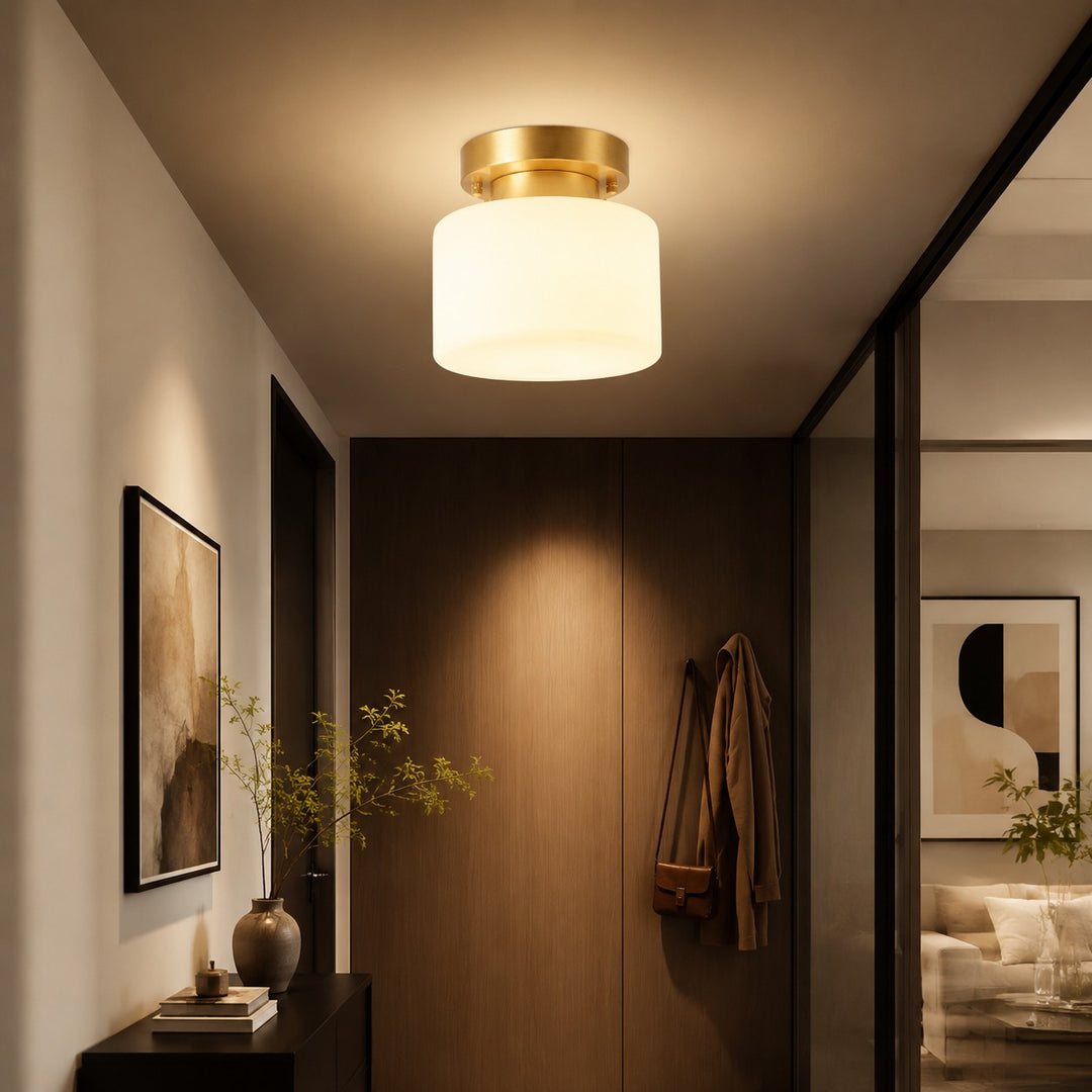 Brass ceiling light in a wood-accented hallway