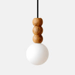 Cargar imagen en el visor de la Galería, Sculptural three-bead wood pendant light with a frosted glass globe on white