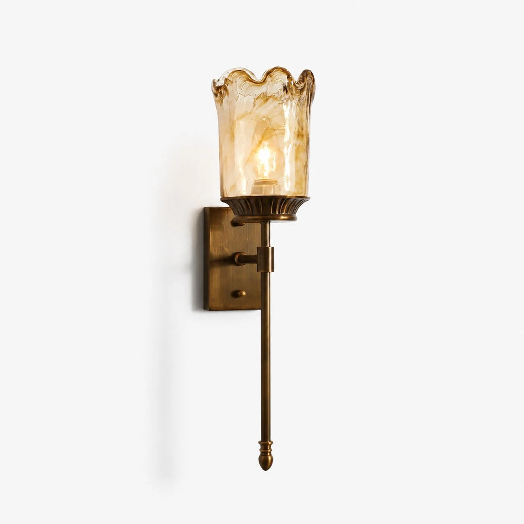 Brass amber glass wall sconce on clean background