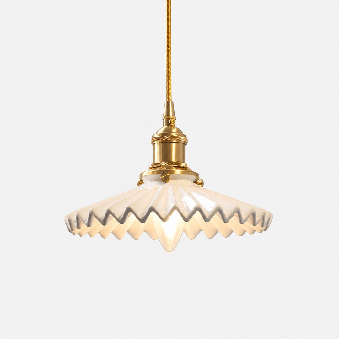 White pleated ceramic pendant light with brass-finish base