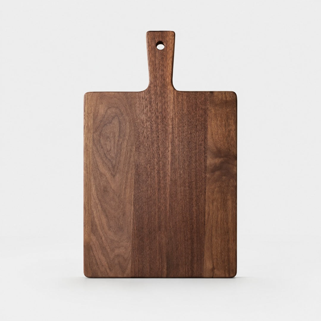 Large black walnut cutting board on a light background