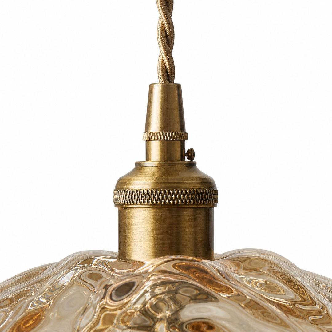 Close-up of antique brass socket and twisted cord