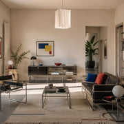 Sculptural linen pendant light installed in a modern living room