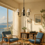 Load image into Gallery viewer, Three-light polka dot chandelier in a sunlit living room