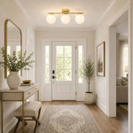 Load image into Gallery viewer, Gold milk glass ceiling light in a modern entryway