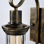Bild in Gallery-Viewer laden, Close view of antique bronze metal cap and clear glass shade