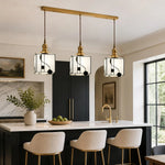 Load image into Gallery viewer, Triple cube pendants above a kitchen island