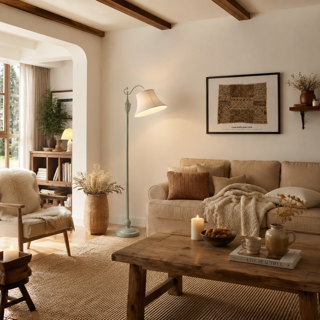 Sage green floor lamp beside a sofa in a warm country living room