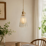 Cargar imagen en el visor de la Galería, Style G vertically ribbed glass pendant beside a softly lit window
