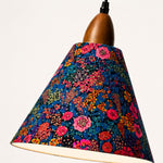 Bild in Gallery-Viewer laden, Angled view of dark botanical shade and walnut-tone wood holder