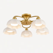 5-light brass ceiling fixture with white glass shades