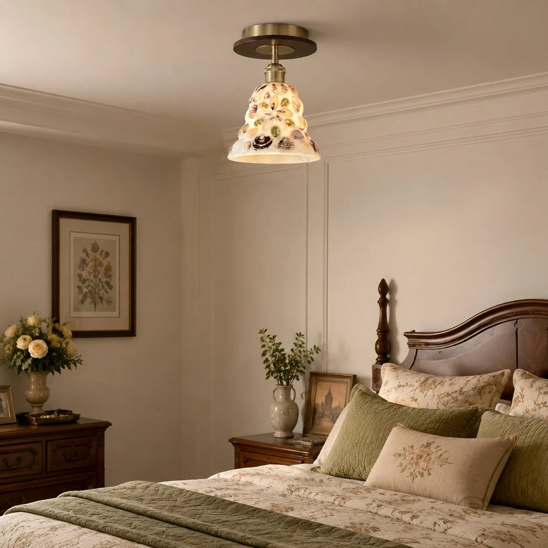 Shell glass ceiling light in a calm bedroom scene