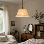 Load image into Gallery viewer, Pleated pendant light glowing in a bedroom setting